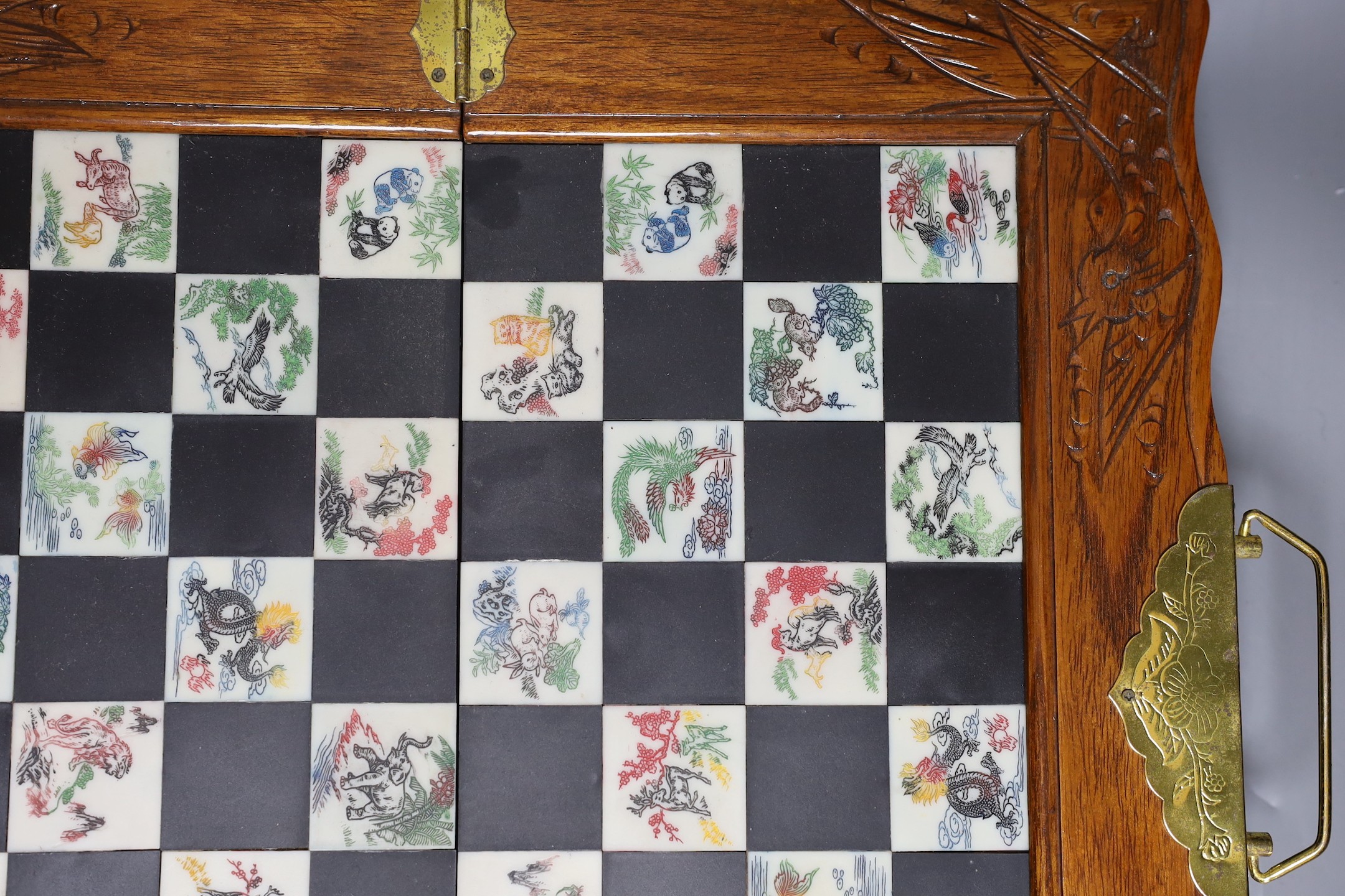 A Chinese chess set with resin pieces, 39x39cm